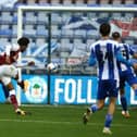 Caleb Chukwuemeka scores Town's third goal during the Sky Bet League One match between Wigan Athletic and Northampton at the DW Stadium in 2020. (Photo by Pete Norton/Getty Images)