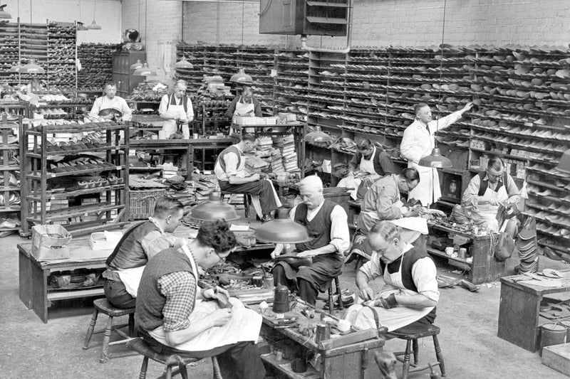 Shoemakers at work in the hand-sewing room helping with post-war trade at Sticklands, Northampton.