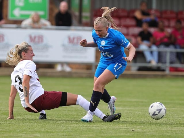 Peterborough's Katie Middleton is tackled by Vicky Barrett