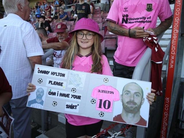 A young Northampton Town fan asks for the shirt of Danny Hylton prior to the Sky Bet League Two between Northampton Town and Hartlepool United at Sixfields on August 13, 2022.