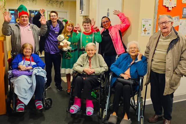 Elm Bank care home residents with staff at the St Thomas More School Christmas Fete