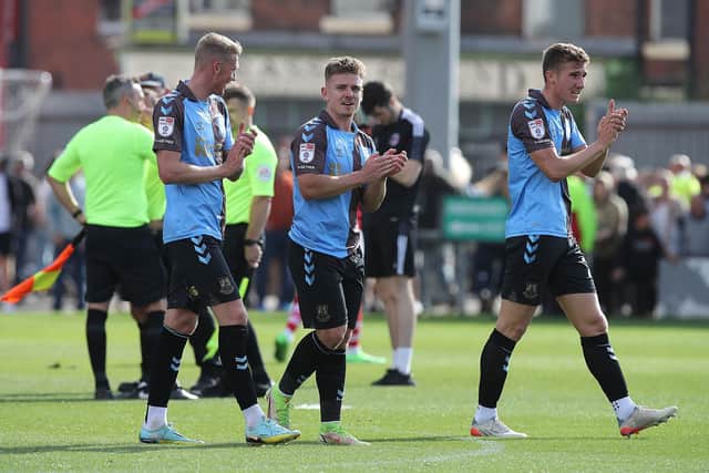 Cobblers players applaud their supporters after Saturday's draw.