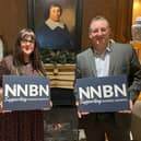 Simon Cox and Marie Baker, founders of NNBN, prepare to welcome the Minister