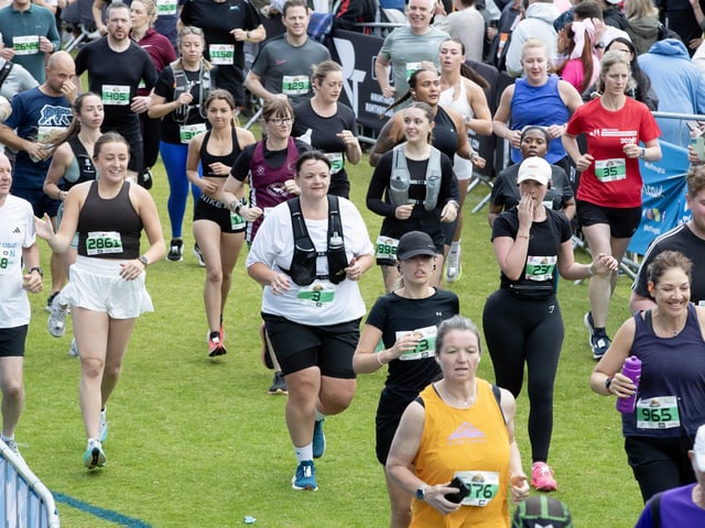 Hundreds of runners braved showers and wind to take on the race on Sunday (May 25), which started and finished at Sixfields stadium.