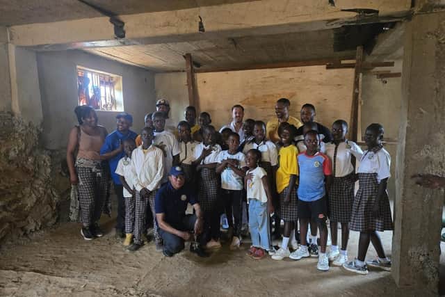 Master Tom Nicholson smiling with the students of his free class in Congo