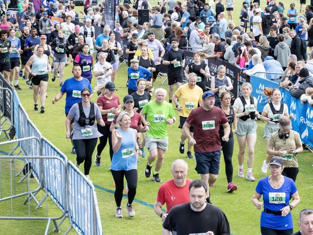 Hundreds of runners braved showers and wind to take on the race on Sunday (May 25), which started and finished at Sixfields stadium.