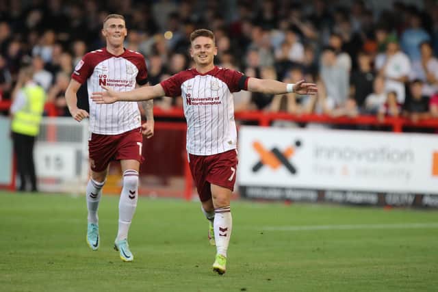 Sam Hoskins wheels away in delight after scoring his second against Crawley.