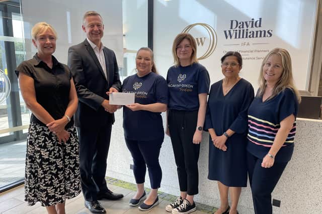 David Williams IFA cheque presentations after the company's annual golf day.