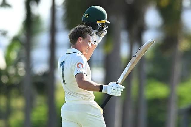 Nathan McSweeney of Australia A celebrates reaching his double century against England Lions at the Allan Border Field in Brisbane on Saturday