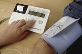 A doctor carries out a blood pressure test for a patient during a medical appointment at a GP surgery (Photo by Charles Milligan/Hulton Archive/Getty Images)