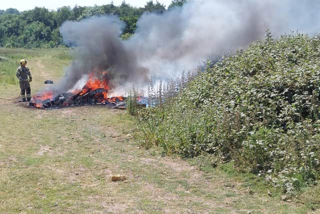 A fly-tip was set on fire in Duston.