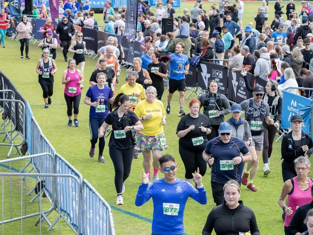 Hundreds of runners braved showers and wind to take on the race on Sunday (May 25), which started and finished at Sixfields stadium.