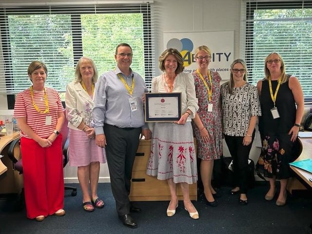 Caroline Brocklehurst DL presenting Nigel Hinch from Ability CIC with a Rose of Northamptonshire Award. Nigel Hinch co-founded Ability CIC to provide better access to transport for those living in rural areas, or who are struggling with the cuts to bus subsidies. Ability CIC now supports over 1,200 members across 62 parishes.
