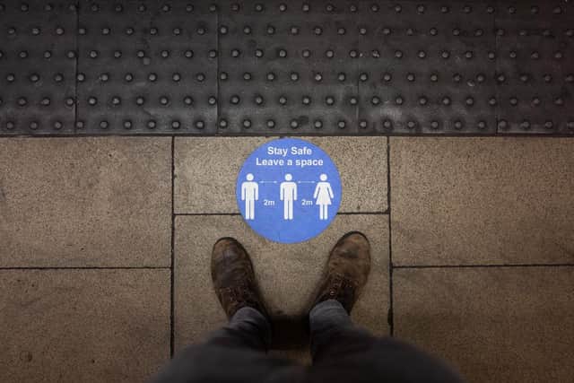 A social distancing sticker is seen on an underground station platform ahead of the evening rush hour in London (Photo: Leon Neal/Getty Images)