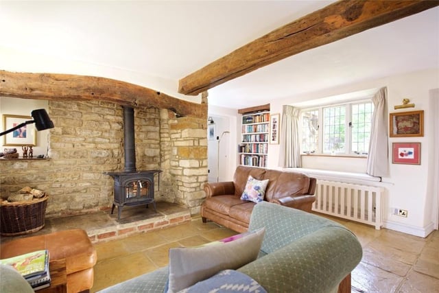 The home has extensive accommodation, ideal for entertaining, as well as traditional features such as ceiling beams and exposed brick.