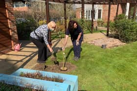 Head Gardener, Alison Roberts, and activities team member, Carol Hamilton, planted a Salix Integra willow in the village’s sensory garden to create a memorial area.