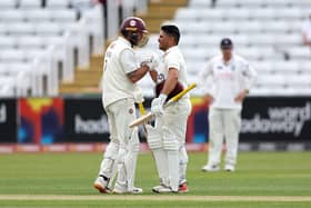 Ricardo Vasconcelos is congratulated by skipper Luke Procter after reaching three figures at Durham