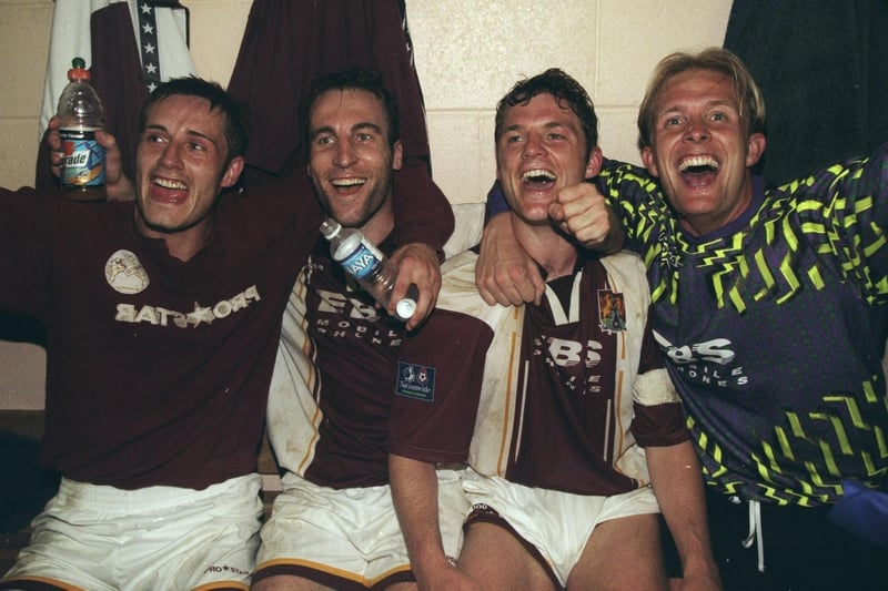 Northampton Town players celebrate in the dressing room after the Nationwide League Division Two play-off semi-final against Bristol Rovers at Sixfields Stadium.