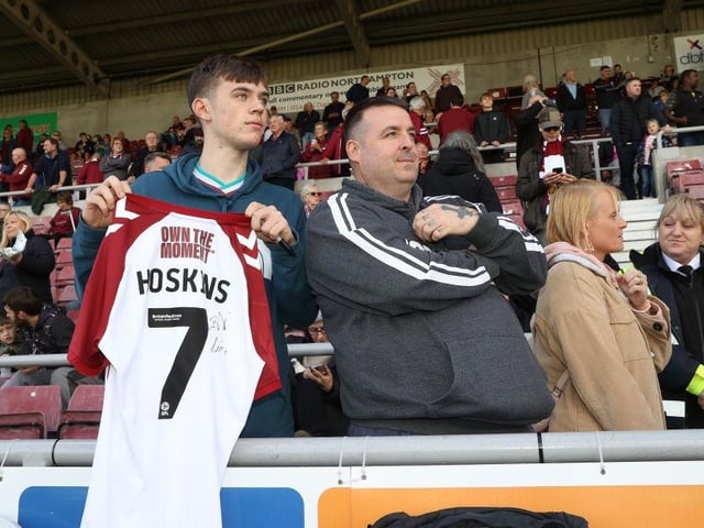 A Northampton Town fan waits to have his shirt signed by Sam Hoskins prior to the Sky Bet League Two between Northampton Town and Salford City at Sixfields on October 08, 2022.