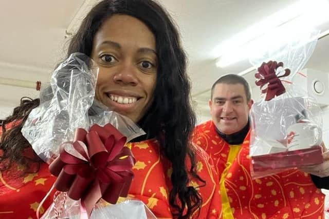 The Lewis Foundation's Lorraine and Lee preparing Christmas hampers.