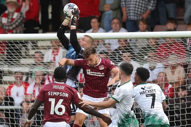 Sam Sherring challenges for the ball during the Cobblers' Sky Bet League One clash with Lincoln City at Sixfields on Tuesday night (Picture: Pete Norton)