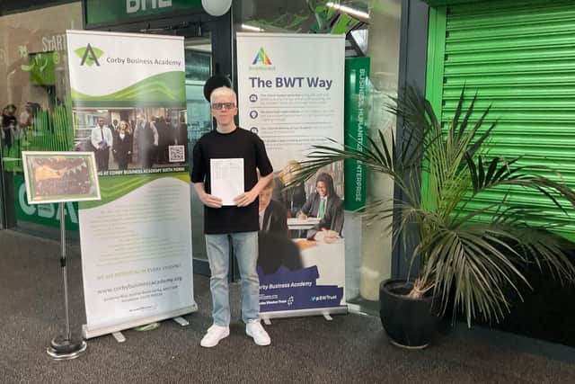 Harry from Corby Business Academy celebrating excellent GCSE results