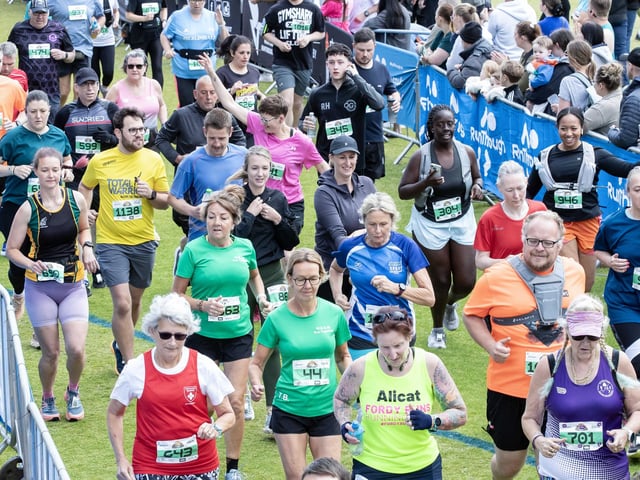 Hundreds of runners braved showers and wind to take on the race on Sunday (May 25), which started and finished at Sixfields stadium.