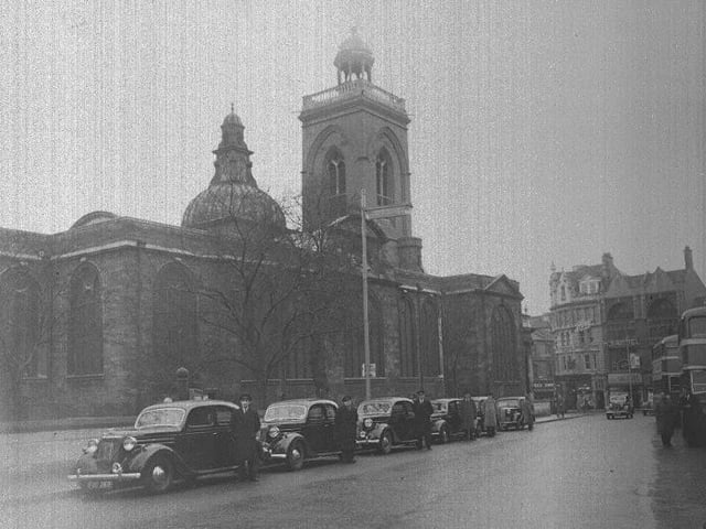 Taxis lined up outside All Saints Church Northampton