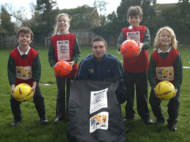 2007: Milton Malsor Parochial Primary School awarded an FA charter standard for delivery of football during term-time and out of school. Pictured: Ryan Sherreard, 10, Paige Sherreard,11, Lee Brown, football development officer for Northamptonshire FA, Aaran Weston, 10 and Louis Diamond, 9, with some of the new equipment