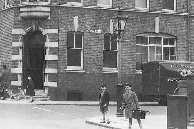 Two young schoolboys standing on the pavement in Adnitt Road, Abington. Year unknown.