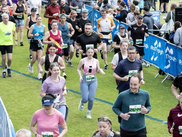 Hundreds of runners braved showers and wind to take on the race on Sunday (May 25), which started and finished at Sixfields stadium.