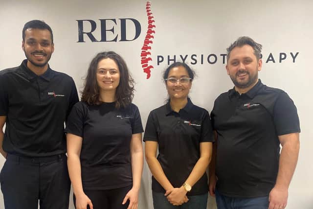 Daniel (far right) with his wife Diana (second from left) and the rest of the RED Physiotherapy team in Northampton.