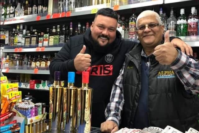 Charlie Sloth posing with former Conservative councillor Suresh Patel at the Best One Shop in Weedon Road in October 2020
