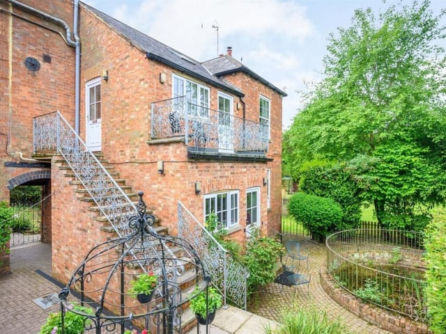 This Victorian home has a tennis court, huge gardens and a private mooring on the River Nene.