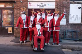 The Mens Club at Northampton Hope Centre get ready to help Chris take part in The Rotary Club Santa Run.