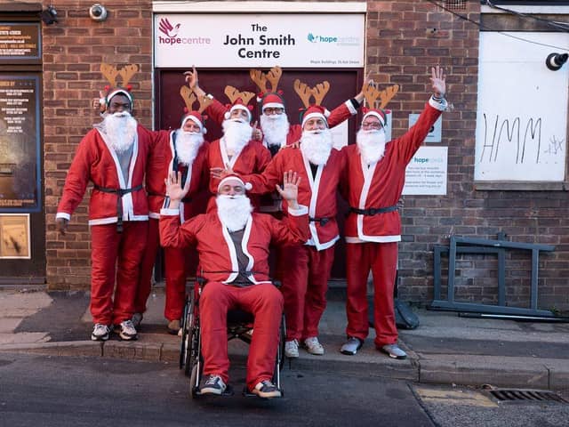 The Mens Club at Northampton Hope Centre get ready to help Chris take part in The Rotary Club Santa Run.
