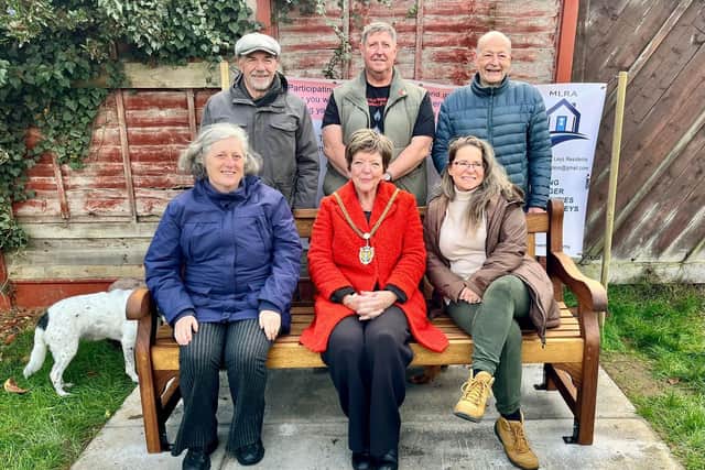 The unveiling of the bench in Moulton Leys brought together members of the community.