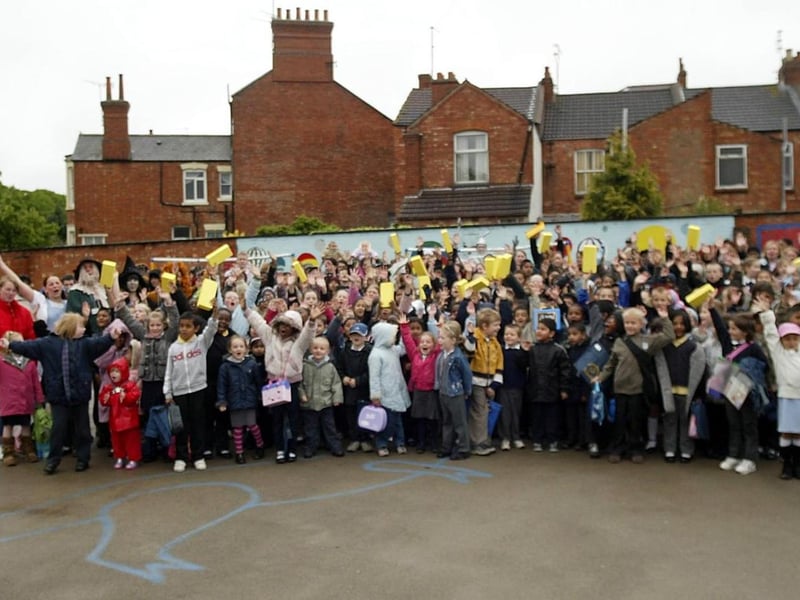 2006 - Council staff in Wizard Of Oz costumes with children from Castle Primary School with yellow bricks, taking part in walk to school week.