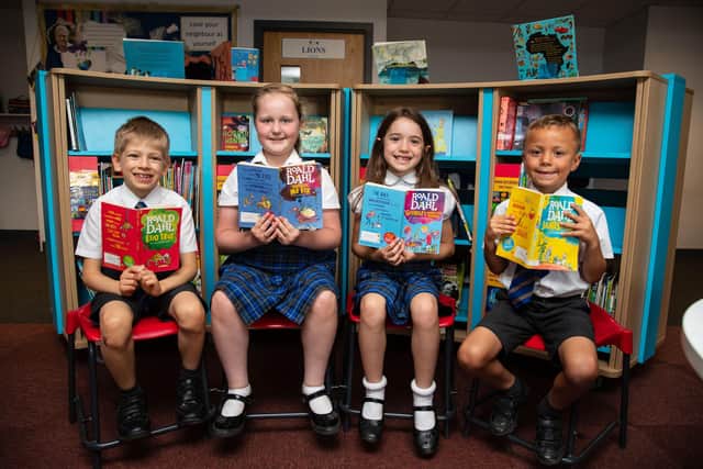 Children from Malcolm Arnold Preparatory School in their library