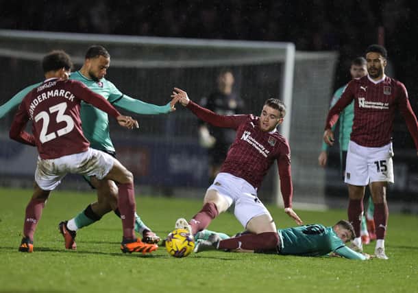 Marc Leonard battles for he ball during the Cobblers' New Year's Day win over Cheltenham Town (Picture: Pete Norton)