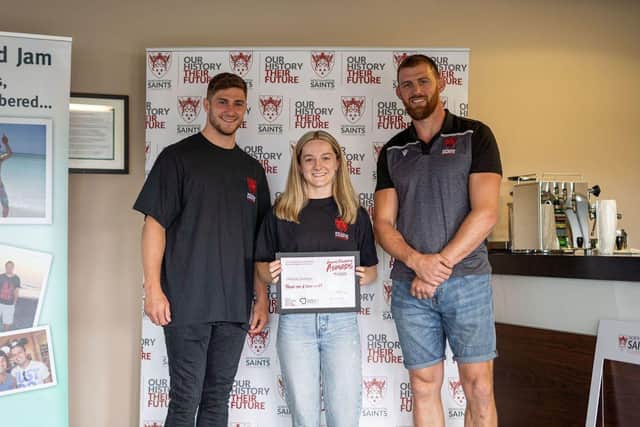 Heledd winning an award for her contribution to the foundation alongside James Grayson and Tom Wood