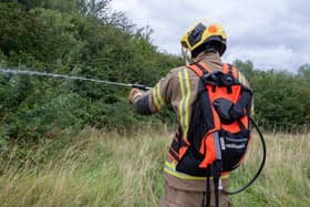 Firefighters used wildfire backpacks to put out the field fire in Northampton. Photo: Twitter/Northamptonshire Fire & Rescue Service.