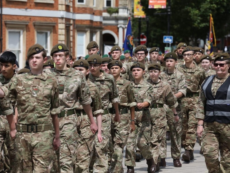 Kettering town centre: crowds line town centre to welcome The Royal Anglian Regiment for Armed Forces Day parade /National World