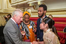 Nurse Maria Kriss Uy meeting King Charles at his 75th birthday reception 
