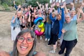 Helen Aluko, pictured holding the balloon, is the founder of a much-loved menopause meet up which recently celebrated its third anniversary at iconic landmark Delapré Abbey.