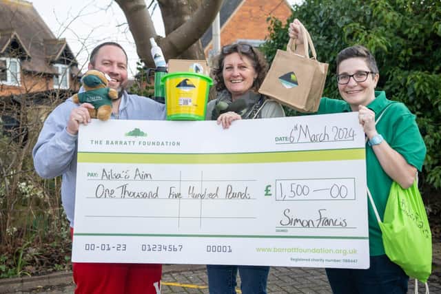 BN - SGB-33501 - Staff from Ailsa's Aim with their cheque from Barratt Homes