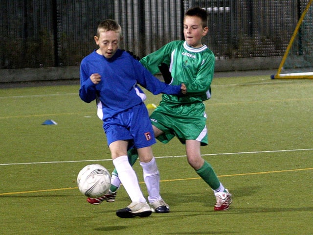 A football tournament at Unity College, organised by Northampton School Sports Partnership. Football action from Simon De Senlis Primary School (green), V Duston Eldean Primary School (blue).