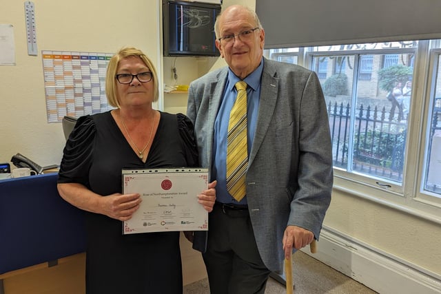Councillor Phil Larratt from West Northants Council presenting Theresa Kelly from Naash, with a Rose of Northamptonshire Award. Theresa Kelly heads up Northampton-based charity Naash, supporting the homeless to find safe and secure housing and work.