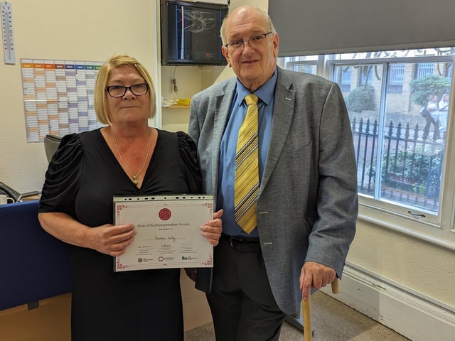 Councillor Phil Larratt from West Northants Council presenting Theresa Kelly from Naash, with a Rose of Northamptonshire Award. Theresa Kelly heads up Northampton-based charity Naash, supporting the homeless to find safe and secure housing and work.