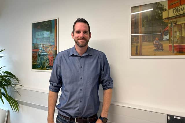 Centre manager Garrick Hurter with some of the art on display.
